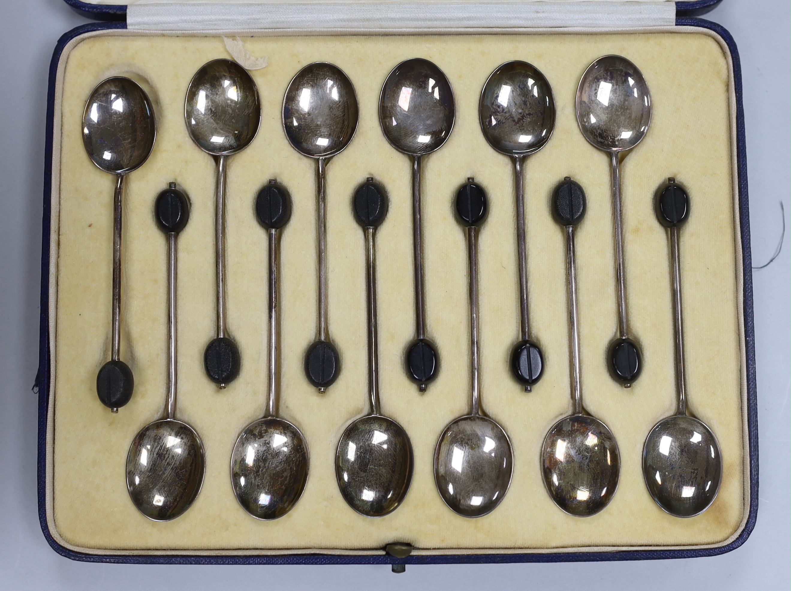 Six assorted cased sets of flatware including bean end coffee spoon, preserve spoons and spoon and pusher.